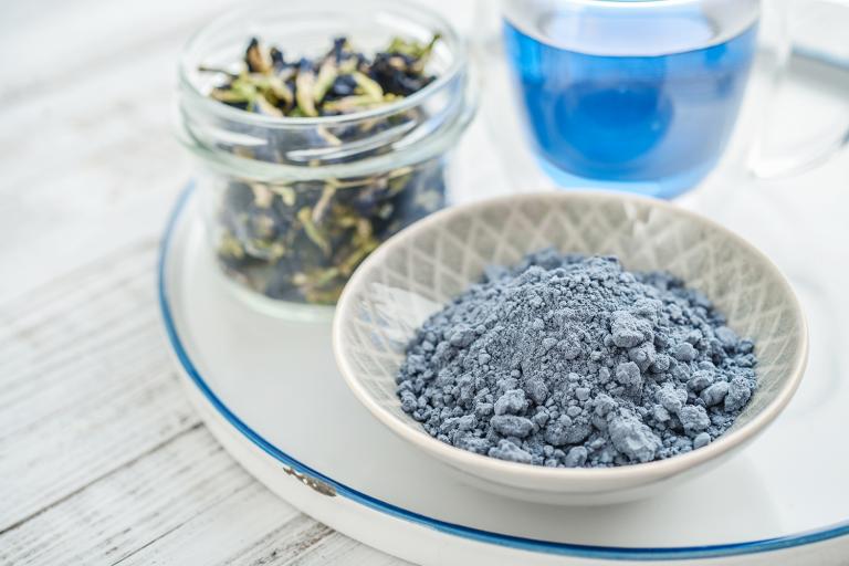 blue matcha powder, dried butterfly pea, and a drink